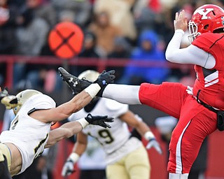 YOUNGSTOWN, OHIO - DECEMBER 10, 2016: Mason Alstatt #13 of Wofford blocks a kick off the foot of punter Mark Schuler #85 of YSU during the first half of their FCS quarterfinal playoff game Saturday afternoon at Stambaugh Stadium. YSU won 30-23 in double overtime. DAVID DERMER | THE VINDICATOR
