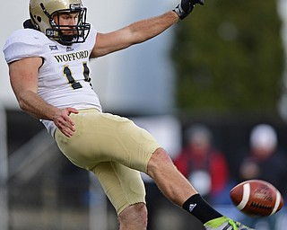 YOUNGSTOWN, OHIO - DECEMBER 10, 2016: Punter David Marvin #14 of Wofford punts during the first half of their FCS quarterfinal playoff game Saturday afternoon at Stambaugh Stadium. YSU won 30-23 in double overtime. DAVID DERMER | THE VINDICATOR