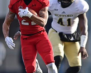 YOUNGSTOWN, OHIO - DECEMBER 10, 2016: Jody Webb #20 of YSU runs the football in the open field after avoiding Jireh Wilson #41 of Wofford during the first half of their FCS quarterfinal playoff game Saturday afternoon at Stambaugh Stadium. YSU won 30-23 in double overtime. DAVID DERMER | THE VINDICATOR