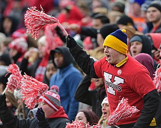 YOUNGSTOWN, OHIO - DECEMBER 10, 2016: YSU student Bobby Lindell screams while waving his pom-pom in the student section during the first half of the FCS quarterfinal playoff game between YSU and Wofford, Saturday afternoon at Stambaugh Stadium. YSU won 30-23 in double overtime. DAVID DERMER | THE VINDICATOR