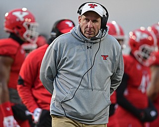 YOUNGSTOWN, OHIO - DECEMBER 10, 2016: Head coach Bo Pelini looks to the scoreboard after a timeout during the second half of their FCS quarterfinal playoff game Saturday afternoon at Stambaugh Stadium. YSU won 30-23 in double overtime. DAVID DERMER | THE VINDICATOR