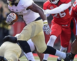YOUNGSTOWN, OHIO - DECEMBER 10, 2016: Lorenzo Long #7 of Wofford runs into the end zone to score a touchdown beating Jameel Smith #26 of YSU during the second half of their FCS quarterfinal playoff game Saturday afternoon at Stambaugh Stadium. YSU won 30-23 in double overtime. DAVID DERMER | THE VINDICATOR