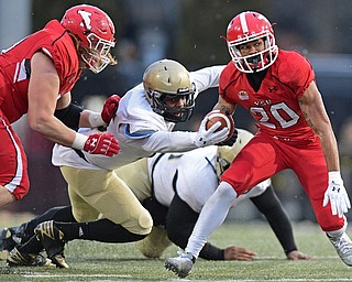 YOUNGSTOWN, OHIO - DECEMBER 10, 2016: Jody Webb #20 of YSU runs the football away from George Gbesee #15 of Wofford during the second half of their FCS quarterfinal playoff game Saturday afternoon at Stambaugh Stadium. YSU won 30-23 in double overtime. DAVID DERMER | THE VINDICATOR