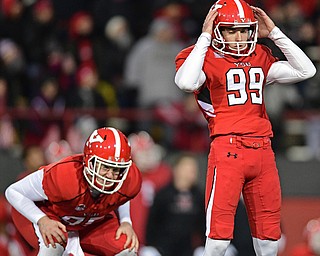 YOUNGSTOWN, OHIO - DECEMBER 10, 2016: Kicker Zak Kennedy #99 of YSU stands in disbelief after missing a game winning kick in overtime of their FCS quarterfinal playoff game Saturday afternoon at Stambaugh Stadium. YSU won 30-23 in double overtime. DAVID DERMER | THE VINDICATOR..Holder Anthony Parente #85 pictured.