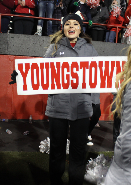 Youngstown State cheerleader Destiny Ketchum holds a Youngstown sign and cheer after the Penguins double overtime victory against Wofford on Saturday afternoon at Stambaugh Stadium. Dustin Livesay  |   The Vindicartor  12/10/16  YSU.