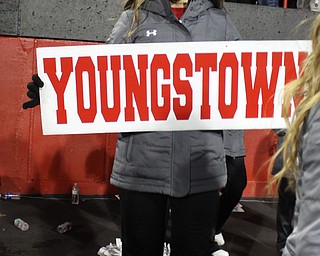 Youngstown State cheerleader Destiny Ketchum holds a Youngstown sign and cheer after the Penguins double overtime victory against Wofford on Saturday afternoon at Stambaugh Stadium. Dustin Livesay  |   The Vindicartor  12/10/16  YSU.