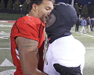 Youngstown State's Derek Rivers (11) hugs a tearful Joe Newman (8) of Wofford after the Penguins double overtime victory against the Terriers on Saturday afternoon at Stambaugh Stadium. Dustin Livesay  |   The Vindicartor  12/10/16  YSU.