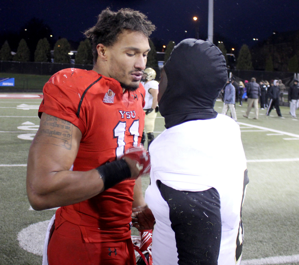 Youngstown State's Derek Rivers greets Wofford quarterback Joe Newman (8) after the Penguins double overtime victory against the Terriers on Saturday afternoon at Stambaugh Stadium. Dustin Livesay  |   The Vindicartor  12/10/16  YSU.
