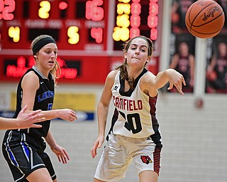 CANFIELD, OHIO - DECEMBER 12, 2016: Alexandra Stanic #20 of Canfield passes the ball while being pressured by Jensen Silbaugh #5 of Lakeview during the first half of their game Monday night at Canfield High School. DAVID DERMER | THE VINDICATOR