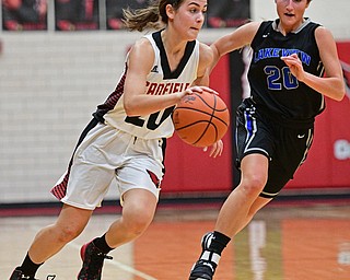 CANFIELD, OHIO - DECEMBER 12, 2016: Alexandra Stanic #20 of Canfield dribbles up court while being pursued by Lindsay Carnahan #20 of Lakeview during the first half of their game Monday night at Canfield High School. DAVID DERMER | THE VINDICATOR