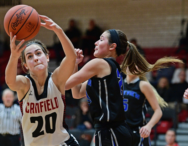 CANFIELD, OHIO - DECEMBER 12, 2016: Alexandra Stanic #20 of Canfield looks the ball into her hands while being bumped by Lindsay Carnahan #20 of Lakeview during the second half of their game Monday night at Canfield High School. DAVID DERMER | THE VINDICATOR