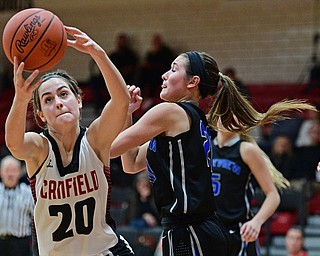CANFIELD, OHIO - DECEMBER 12, 2016: Alexandra Stanic #20 of Canfield looks the ball into her hands while being bumped by Lindsay Carnahan #20 of Lakeview during the second half of their game Monday night at Canfield High School. DAVID DERMER | THE VINDICATOR