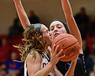 CANFIELD, OHIO - DECEMBER 12, 2016: Ashley Veneroso #23 of Canfield goes to the basket while bumping Jensen Silbaugh #5 of Lakeview during the second half of their game Monday night at Canfield High School. DAVID DERMER | THE VINDICATOR