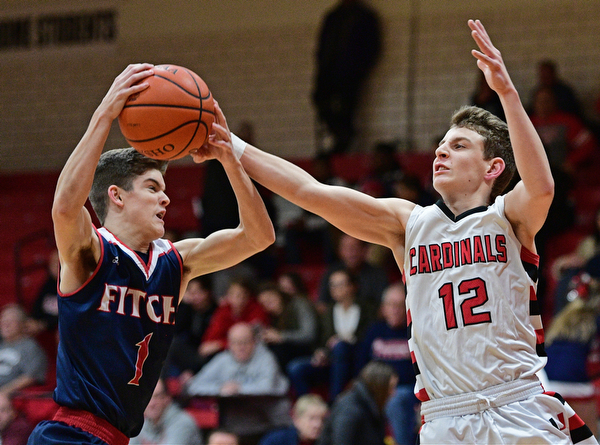 CANFIELD, OHIO - DECEMBER 12, 2016: Zac Bruff #1 of Fitch intercepts a pass intended for Ethan Kalina #12 of Canfield during the first half of their game Tuesday night at Canfield High School. DAVID DERMER | THE VINDICATOR