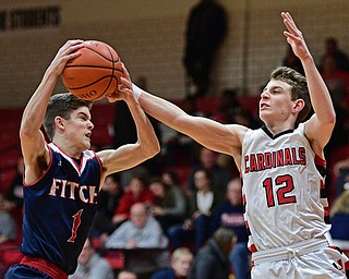 CANFIELD, OHIO - DECEMBER 12, 2016: Zac Bruff #1 of Fitch intercepts a pass intended for Ethan Kalina #12 of Canfield during the first half of their game Tuesday night at Canfield High School. DAVID DERMER | THE VINDICATOR