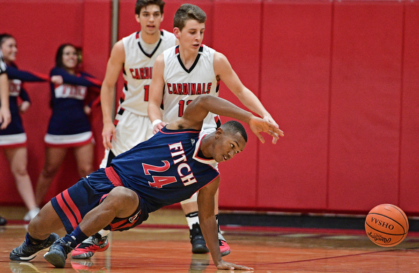 CANFIELD, OHIO - DECEMBER 12, 2016: Jakari Lumsden #24 of Fitch reaches back for the ball after losing control of it while being pressured by Ethan Kalina #12 of Canfield during the second half of their game Tuesday night at Canfield High School. DAVID DERMER | THE VINDICATOR