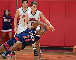 CANFIELD, OHIO - DECEMBER 12, 2016: Jakari Lumsden #24 of Fitch reaches back for the ball after losing control of it while being pressured by Ethan Kalina #12 of Canfield during the second half of their game Tuesday night at Canfield High School. DAVID DERMER | THE VINDICATOR