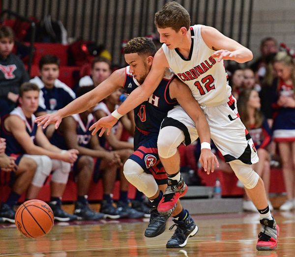 CANFIELD, OHIO - DECEMBER 12, 2016: Randy Smith #0 of Fitch and Ethan Kalina #12 of Canfield jockey for position while chasing after the loose ball during the second half of their game Tuesday night at Canfield High School. DAVID DERMER | THE VINDICATOR