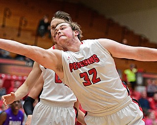 YOUNGSTOWN, OHIO - DECEMBER 13, 2016: Jorden Kaufman #32 of YSU extends to grab a rebound during the first half of their game Wednesday night at the Beeghly Center. DAVID DERMER | THE VINDICATOR
