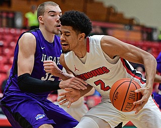 YOUNGSTOWN, OHIO - DECEMBER 13, 2016: Devin Haygood #2 of YSU drives on Dominic Robb #32 of Niagara during the first half of their game Wednesday night at the Beeghly Center. DAVID DERMER | THE VINDICATOR