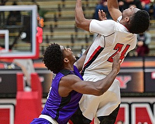YOUNGSTOWN, OHIO - DECEMBER 13, 2016: Cameron Morse #24 of YSU catches an in bounds pass while being pressured by Chris Barton #0 of Niagara during the first half of their game Wednesday night at the Beeghly Center. DAVID DERMER | THE VINDICATOR