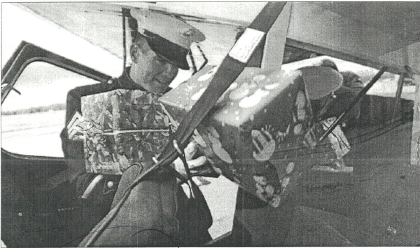 Sgt. Matthew Lynch from the local Marine Corps Reserve Toys for Tots, loads packages into Santa's plane to be delivered to the North Pole. VOlunteers from Accordia-Wells Fargo collected the toys to be distributed to local needy children. Santa made his appearance Thursday at the Youngstown Warren Regional Airport for the delivery. December 20, 2001 (Bruce Palmer | The Vindicator)