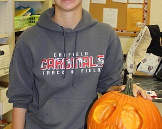 Neighbors | Abby Slanker.Canfield High School art club member Emily Hrina carved Jack Skeleton from “Nightmare Before Christmas” on her pumpkin during the club’s Creative Carving event on Oct. 27.
