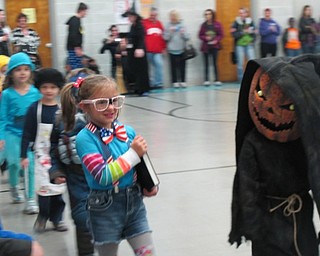 Neighbors | Alexis Bartolomucci.Students in Terry Wittenauer's class at Poland North Preschool walked around the gymnasium in their costumes on Oct. 31 for the Halloween parade.
