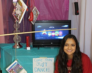 Neighbors | Abby Slanker.Ava Dasari, Canfield High School senior physics student, showed off her group’s interactive Just Dance mobile for the school’s annual Mobile Mania Day Nov. 2.