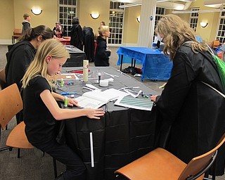 Neighbors | Alexis Bartolomucci.Children at the Poland library Hogwarts Potions Class on Nov. 10 created their own books to take notes in.