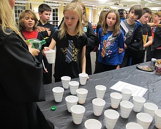 Neighbors | Alexis Bartolomucci.Children at the Hogwarts Potion Class at the Poland library on Nov. 10 got drinks that turned a certain color and told their fortune.