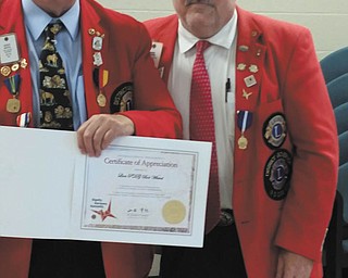 SPECIAL TO THE VINDICATOR
Bob Whited, left, of the Austintown Lions, past district governor of the Ohio Lions District 13 OH4, recently received a certificate of appreciation for fulfilling the mission of Lions Clubs International from immediate past district governor Bob Allgood of East Liverpool. Last year, Whited helped found the First Charter Club in Ohio during the Lions Centennial Year.