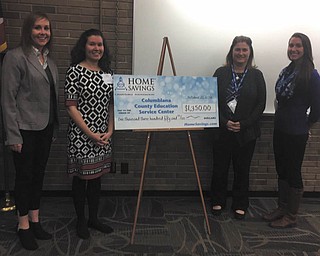 SPECIAL TO THE VINDICATOR
Home Savings Charitable Foundation recently donated $1,350 to the Columbiana County Educational Service Center. The money was used to sponsor the Columbiana County Youth Leadership Summit at Kent State University on Oct. 21. The summit provided eighth- and ninth-grade students with leadership workshops to help them plan and implement community service projects during the school year. Six local districts participated and 74 students attended. The event featured a presentation by Rachel Darroch of Rustic Pathways Foundation and interactive sessions led by the Effective Leadership Academy. Present for the donation, from left, were Abby McLemore, Home Savings Salem and Columbiana retail manager; Danielle Dillon, CCESC coordinator; Flo Brett, ELA executive director; and Sara Luehring, ELA program facilitator. For information on CCESC, call 330-424-9591 or visit www.ccesc.k12.oh.us.