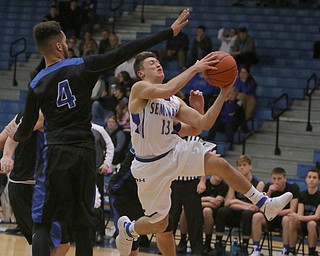 Poland's Brandon Barringer (13) goes up for a shot while defended by Lakeview's Jatise Garrison Jr. (4) during the first half of Frifday nights matchup at Poland Seminary High School.  Dustin Livesay  |  The Vindicator  12/16/16  Poland.