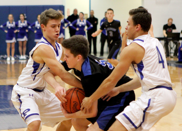 Poland's Mike Diaz (2,left) and Trent Lutz (4,right) try to steal the ball from Lakeview's TJ Lynch (5,middle) during the first half of Friday nights matchup at Poland Seminary High School.  Dustin Livesay  |  The Vindicator  12/16/16  Poland.