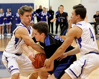 Poland's Mike Diaz (2,left) and Trent Lutz (4,right) try to steal the ball from Lakeview's TJ Lynch (5,middle) during the first half of Friday nights matchup at Poland Seminary High School.  Dustin Livesay  |  The Vindicator  12/16/16  Poland.