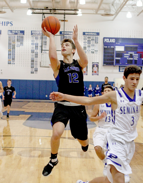 Lakeview's Chris Muir (12) puts up a layup after avoiding the block by Poland's Braeden O'Shaugnessy (3) during the second half of Friday nights matchup at Poland Seminary High School.  Dustin Livesay  |  The Vindicator  12/16/16  Poland.