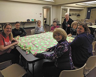 SPECIAL TO THE VINDICATOR
Youngstown Alumnae Panhellenic Association participated in National Philanthropy Day by making two no-sew blankets for Making Kids Count, a nonprofit organization that serves local foster children. Members also purchased sunflower petals to honor a sister, friend or member which funds its scholarship endowments. The association also welcomed new members Jennifer Phillips of Alpha Xi Delta Fraternity and Jennifer Rinehart of Alpha Sigma Tau Sorority. Each were presented with a rose and certificate of membership. YAPA members, from left, are Amy Banks, Rinehart, Arlene Farris, Angie Bulkie, Sally Ocker, Barbara Banks, Lynn Sorber and Katie Shipka.