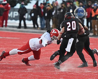 CHENEY, WA - DECEMBER 17: Youngstown State free safety Jalyn Powell (16) attempts to bring down EWU running back Sam McPherson (20) during the game between the Youngstown State University Penguins and the Eastern Washington University Eagles on December 17, 2016 at Roos Field in Cheney, Washington.  (Photo by Robert Johnson).