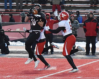 CHENEY, WA - DECEMBER 17: EWU wide receiver Cooper Kupp (10)  hauls in a long pass as Youngstown State cornerback D.J. Thomas (18) and linebacker Lee Wright (5)  defend during the game between the Youngstown State University Penguins and the Eastern Washington University Eagles on December 17, 2016 at Roos Field in Cheney, Washington.  (Photo by Robert Johnson).