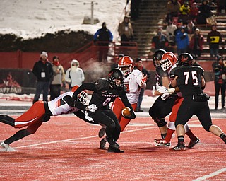 CHENEY, WA - DECEMBER 17: Youngstown State sophomore linebacker Lee Wright (5) catches EWU sophomore quarterback Gage Gubrud (8) from behind during the game between the Youngstown State University Penguins and the Eastern Washington University Eagles on December 17, 2016 at Roos Field in Cheney, Washington.  (Photo by Robert Johnson).