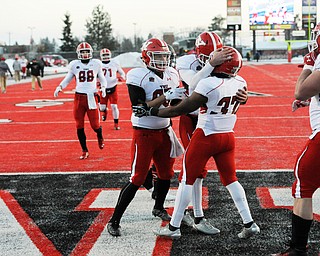 CHENEY, WA - DECEMBER 17: Youngstown State sophomore tailback Kevin McCaster is congratulated after scoring during the game between the Youngstown State University Penguins and the Eastern Washington University Eagles on December 17, 2016 at Roos Field in Cheney, Washington.  (Photo by Robert Johnson).