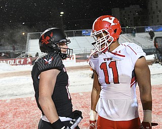 CHENEY, WA - DECEMBER 17: EWU senior wide receiver Cooper Kupp (10) and Youngstown State junior defensive end Derek Rivers (11) have a word after the game between the Youngstown State University Penguins and the Eastern Washington University Eagles on December 17, 2016 at Roos Field in Cheney, Washington.  (Photo by Robert Johnson).