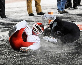 CHENEY, WA - DECEMBER 17: Youngstown State senior running back Demond Hymes (5) embraces this touchdown catch during the game between the Youngstown State University Penguins and the Eastern Washington University Eagles on December 17, 2016 at Roos Field in Cheney, Washington.  (Photo by Robert Johnson).