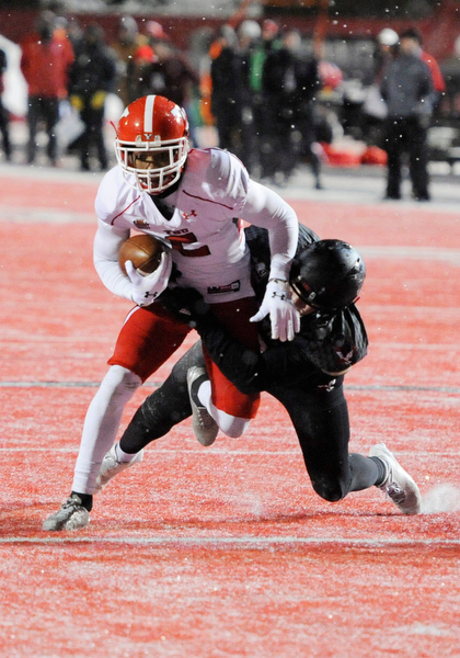 CHENEY, WA - DECEMBER 17: Youngstown State senior running back Demond Hymes (5) is hauled down after making a catch during the game between the Youngstown State University Penguins and the Eastern Washington University Eagles on December 17, 2016 at Roos Field in Cheney, Washington.  (Photo by Robert Johnson).