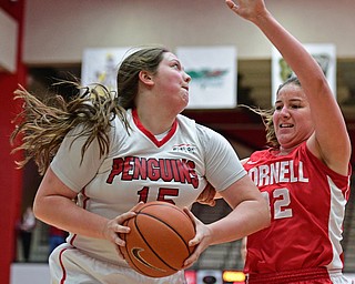 YOUNGSTOWN, OHIO - DECEMBER 17, 2016: Mary Dunn #15 of YSU spins to the basket while being defensed by Nicholle Aston #32 of Cornell during the first half of their game Saturday afternoon at the Beeghly Center. Cornell won 80-75. DAVID DERMER | THE VINDICATOR