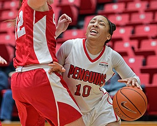 YOUNGSTOWN, OHIO - DECEMBER 17, 2016: Mailee Jones #10 of YSU drives on Kerri Moran #22 of Cornell during the first half of their game Saturday afternoon at the Beeghly Center. Cornell won 80-75. DAVID DERMER | THE VINDICATOR