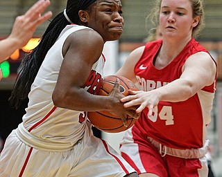 YOUNGSTOWN, OHIO - DECEMBER 17, 2016: Indiya Benjamin #3 of YSU drives on Marie Hatch #34 of Cornell during the first half of their game Saturday afternoon at the Beeghly Center. Cornell won 80-75. DAVID DERMER | THE VINDICATOR