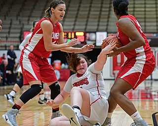 YOUNGSTOWN, OHIO - DECEMBER 17, 2016: Mary Dunn #15 of YSU falls on the floor after having the ball taken away by Nia Marshall #24 of Cornell after being pressured by Marshall and Danielle Jorgenson #4 during the first half of their game Saturday afternoon at the Beeghly Center. Cornell won 80-75. DAVID DERMER | THE VINDICATOR