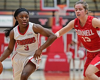 YOUNGSTOWN, OHIO - DECEMBER 17, 2016: Indiya Benjamin #3 of YSU drives on Caroline Shelquist #13 of Cornell during the first half of their game Saturday afternoon at the Beeghly Center. Cornell won 80-75. DAVID DERMER | THE VINDICATOR